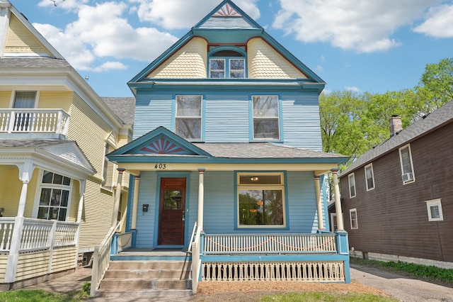 victorian-style house featuring a porch
