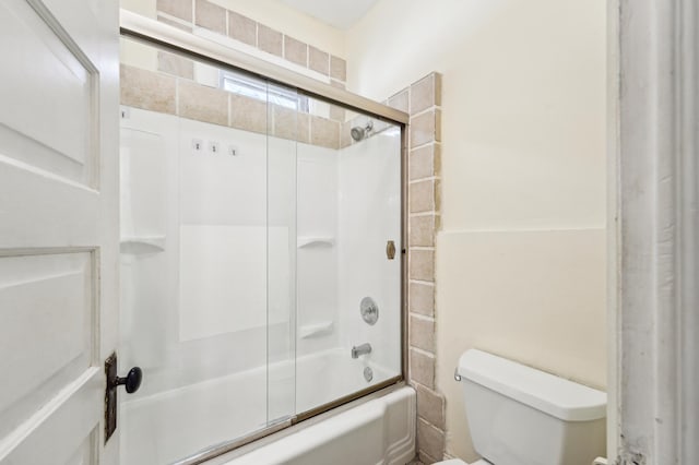 full bath with toilet and enclosed tub / shower combo