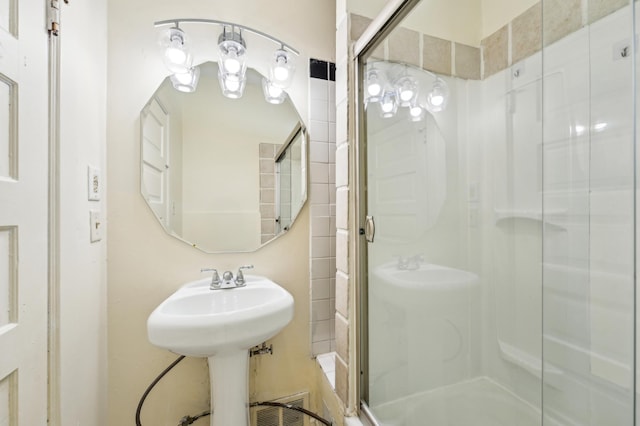full bath featuring a shower stall
