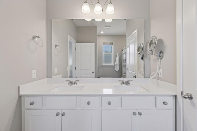 full bath featuring double vanity and a sink