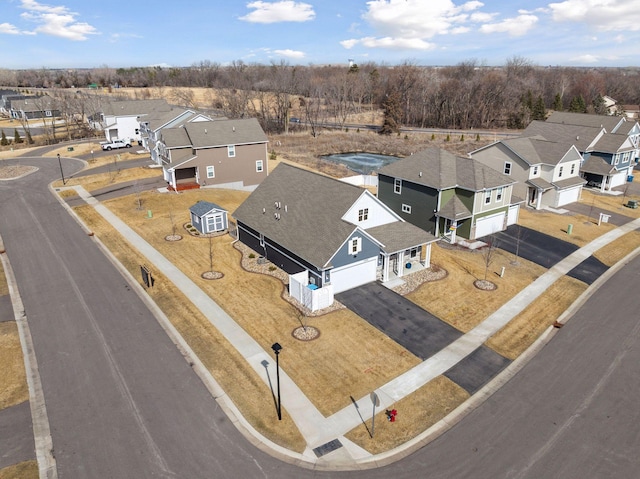 birds eye view of property with a residential view