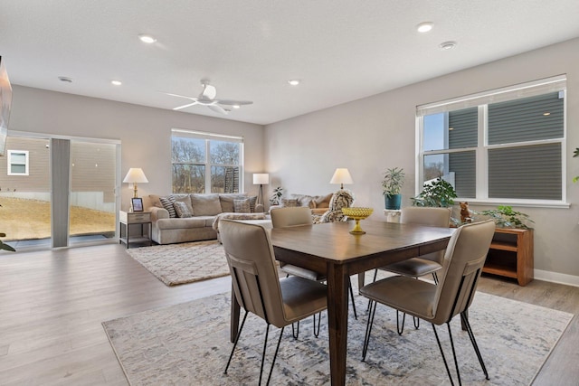 dining area with recessed lighting, light wood-style flooring, baseboards, and ceiling fan