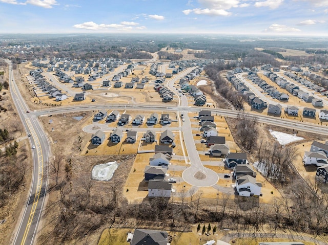 birds eye view of property with a residential view