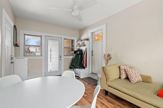 dining space featuring ceiling fan and wood finished floors