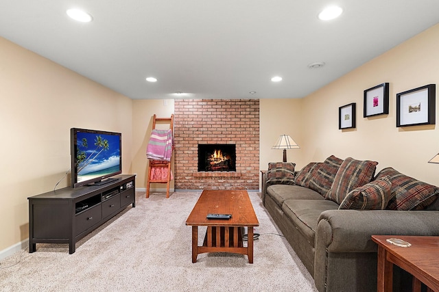 living room with recessed lighting, baseboards, light carpet, and a fireplace