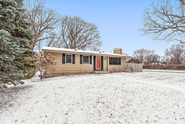 ranch-style house with fence