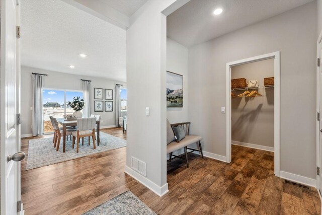 foyer featuring visible vents, recessed lighting, baseboards, and wood finished floors