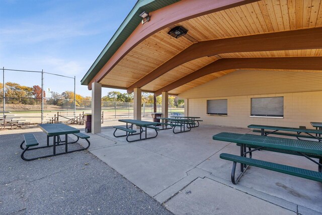 view of home's community with a patio and fence