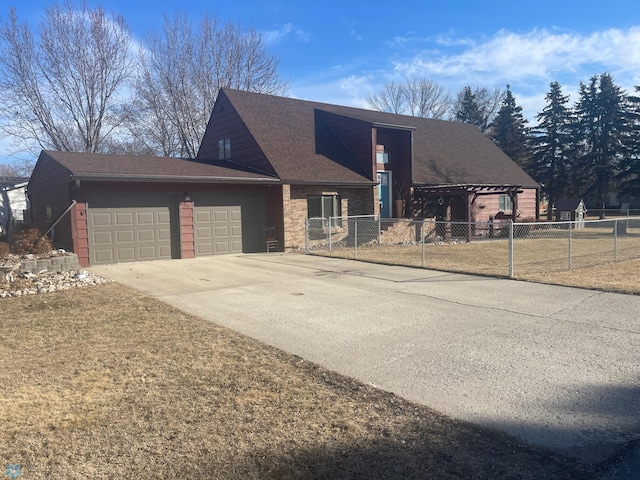 view of front facade featuring an attached garage, fence, and driveway