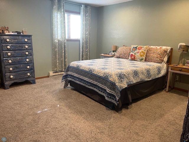 bedroom with baseboards, a baseboard heating unit, and carpet