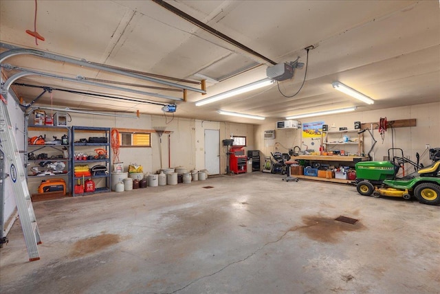 garage featuring a workshop area and a garage door opener