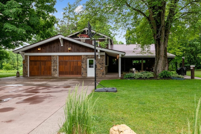 N2699 County Road A, Salem Twp, WI 54750 - view of front of property with stone siding, concrete driveway, and a front lawn