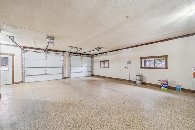 N2699 County Road A, Salem Twp, WI 54750 - garage featuring a garage door opener and baseboards