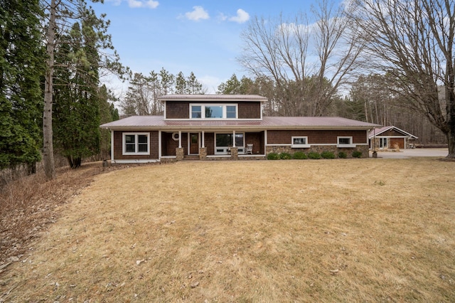 N2699 County Road A, Salem Twp, WI 54750 - view of front facade with a porch, a metal roof, and a front lawn