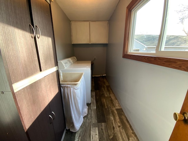 laundry room featuring dark wood-style floors, cabinet space, and washer and clothes dryer