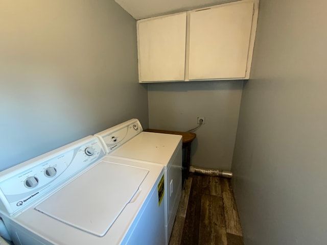 laundry area featuring cabinet space, dark wood-style floors, and independent washer and dryer