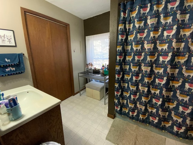 full bathroom with tile patterned floors, vanity, and a shower with curtain