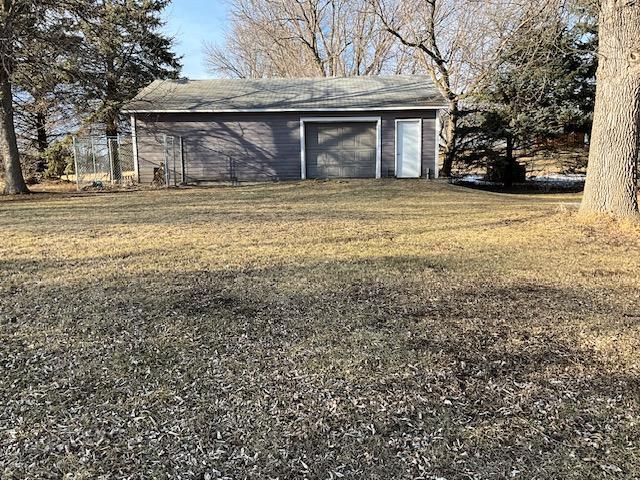 view of outdoor structure with an outbuilding and an attached garage