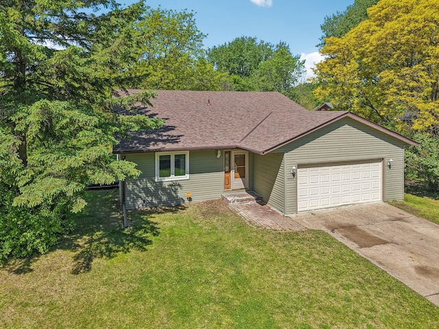 2605 Forest St, Maplewood, MN 55109 - view of front of home featuring a garage, a front lawn, driveway, and roof with shingles