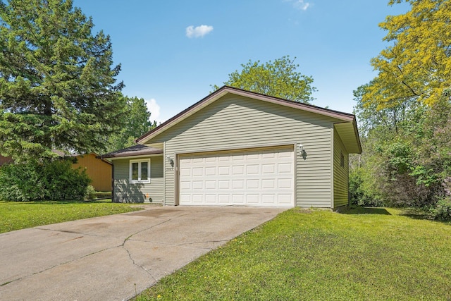 2605 Forest St, Maplewood, MN 55109 - ranch-style house with a front yard, concrete driveway, and an attached garage