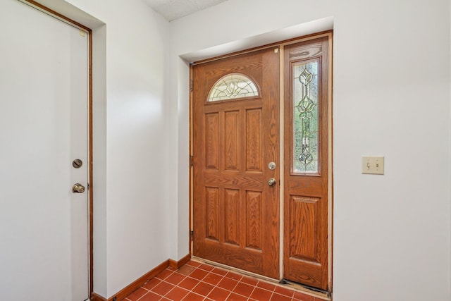 2605 Forest St, Maplewood, MN 55109 - foyer with baseboards and dark tile patterned flooring
