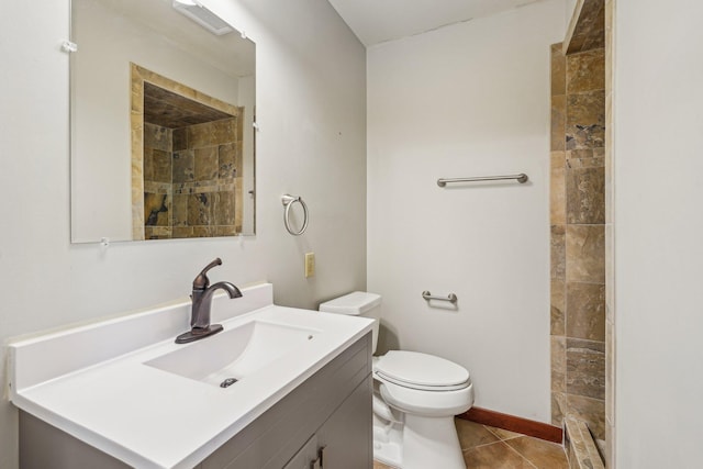2605 Forest St, Maplewood, MN 55109 - bathroom featuring vanity, toilet, tile patterned flooring, and a tile shower