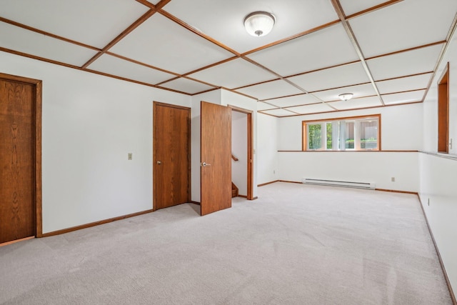 2605 Forest St, Maplewood, MN 55109 - empty room featuring a baseboard heating unit, carpet flooring, and baseboards