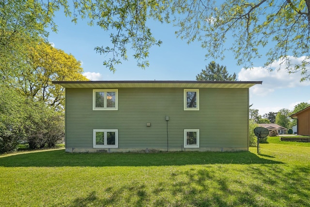 2605 Forest St, Maplewood, MN 55109 - back of house featuring a lawn