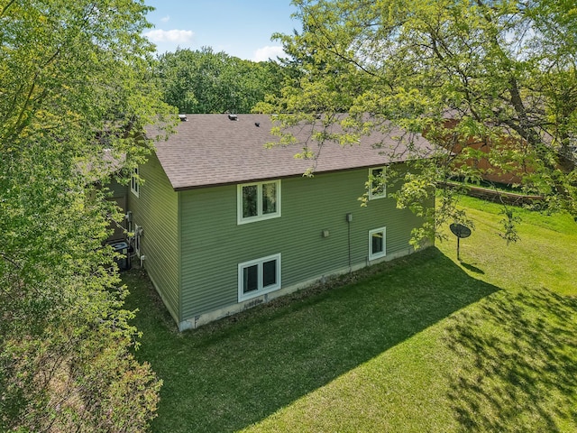 2605 Forest St, Maplewood, MN 55109 - back of house featuring a lawn and a shingled roof