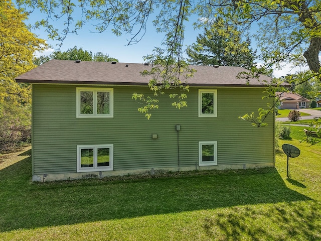 2605 Forest St, Maplewood, MN 55109 - rear view of house with a lawn