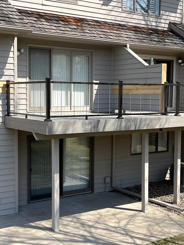 back of house with a balcony