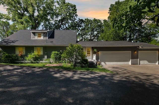 W3527 2nd St, Maiden Rock, WI 54750 - view of front of house featuring driveway and an attached garage