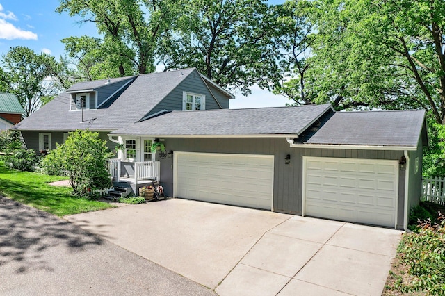 W3527 2nd St, Maiden Rock, WI 54750 - view of front of property with an attached garage, a shingled roof, and concrete driveway