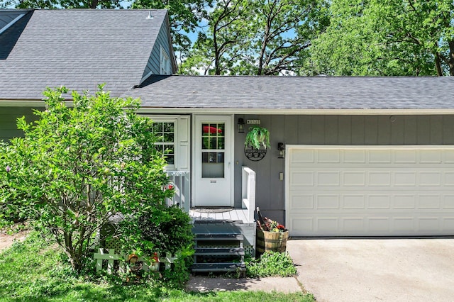 W3527 2nd St, Maiden Rock, WI 54750 - view of front of house featuring a shingled roof, an attached garage, and concrete driveway