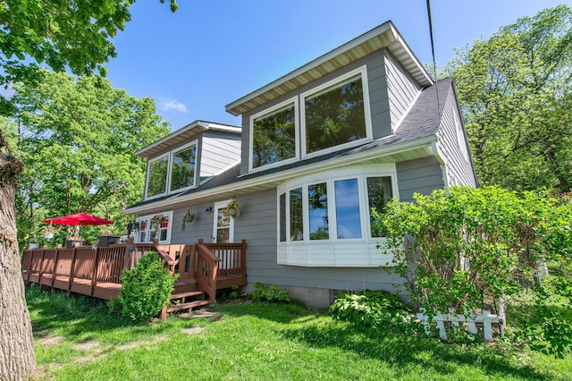 W3527 2nd St, Maiden Rock, WI 54750 - back of property featuring a lawn, a wooden deck, and a shingled roof