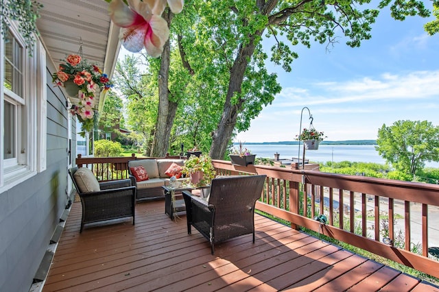 W3527 2nd St, Maiden Rock, WI 54750 - wooden deck featuring an outdoor hangout area and a water view