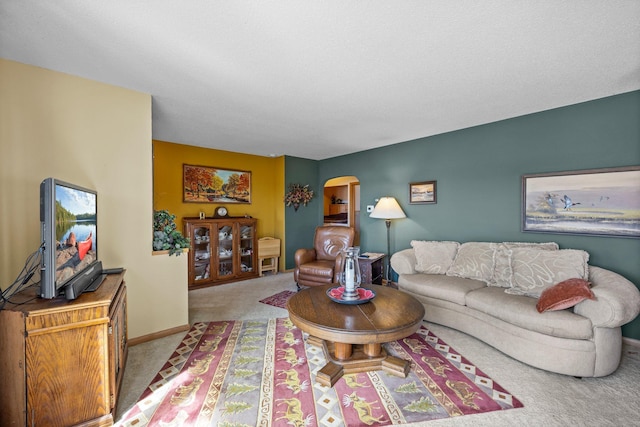 W3527 2nd St, Maiden Rock, WI 54750 - carpeted living area featuring arched walkways and baseboards