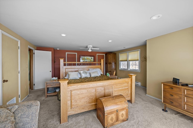 W3527 2nd St, Maiden Rock, WI 54750 - bedroom with light colored carpet, a baseboard heating unit, recessed lighting, and baseboards
