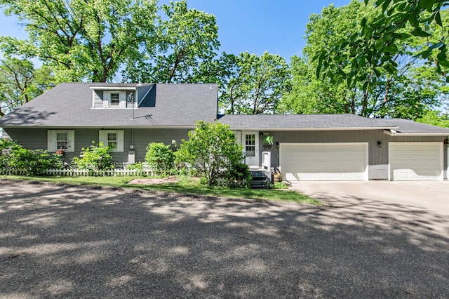 W3527 2nd St, Maiden Rock, WI 54750 - view of front of home with a garage, driveway, and roof with shingles