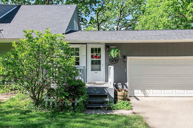 W3527 2nd St, Maiden Rock, WI 54750 - doorway to property with a garage, a shingled roof, and driveway
