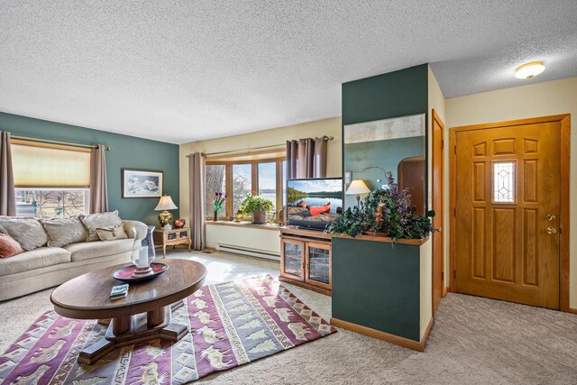 W3527 2nd St, Maiden Rock, WI 54750 - living area featuring a baseboard heating unit, carpet floors, and a textured ceiling