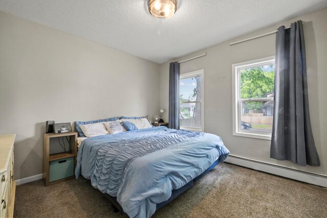 588 Van Buren Ave, Saint Paul, MN 55103 - carpeted bedroom with baseboard heating, a textured ceiling, and baseboards