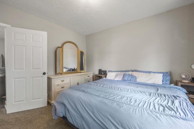 588 Van Buren Ave, Saint Paul, MN 55103 - carpeted bedroom with a textured ceiling and vaulted ceiling