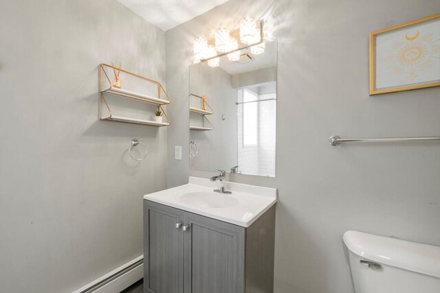 588 Van Buren Ave, Saint Paul, MN 55103 - bathroom featuring a baseboard radiator, vanity, toilet, and a chandelier