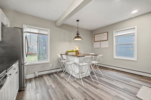 588 Van Buren Ave, Saint Paul, MN 55103 - dining room featuring a baseboard radiator, light wood finished floors, beam ceiling, baseboards, and recessed lighting