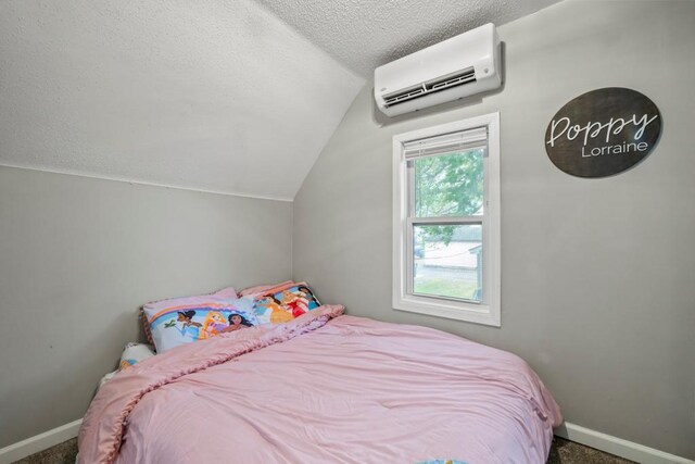 588 Van Buren Ave, Saint Paul, MN 55103 - carpeted bedroom with a wall mounted AC, lofted ceiling, baseboards, and a textured ceiling
