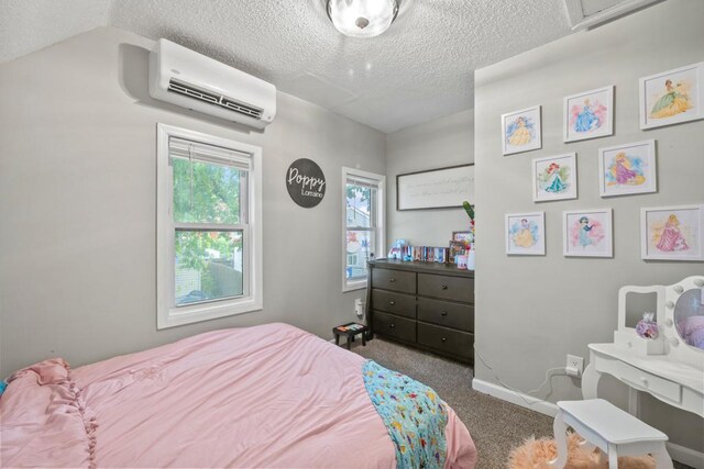 588 Van Buren Ave, Saint Paul, MN 55103 - bedroom with a wall mounted air conditioner, carpet flooring, a textured ceiling, and baseboards