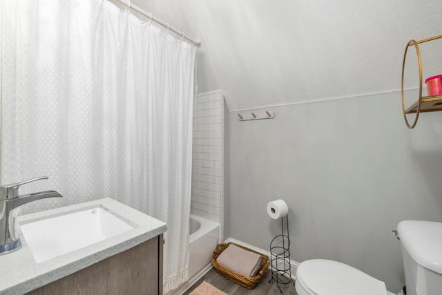 588 Van Buren Ave, Saint Paul, MN 55103 - full bathroom with toilet, baseboards, lofted ceiling, shower / bath combo with shower curtain, and vanity