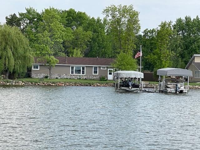 18063 Bernard Trl, Brainerd, MN 56401 - water view featuring boat lift and a dock