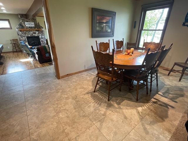 18063 Bernard Trl, Brainerd, MN 56401 - dining room with a fireplace and baseboards